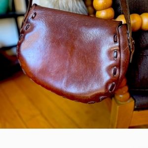 SOLDhippie style leather bag embossed.Ex condition 70's